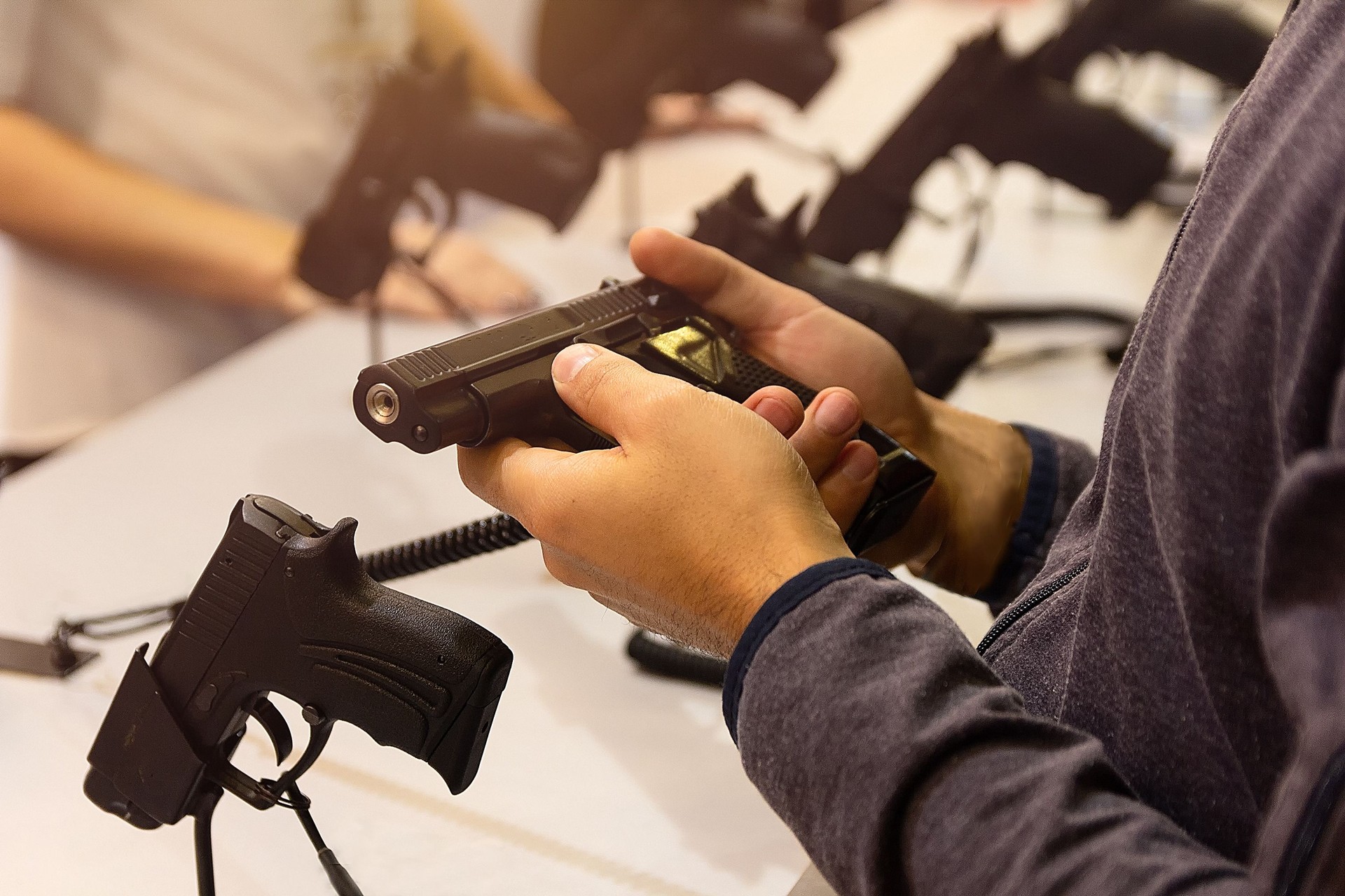 Buyer chooses a gun in a gun shop