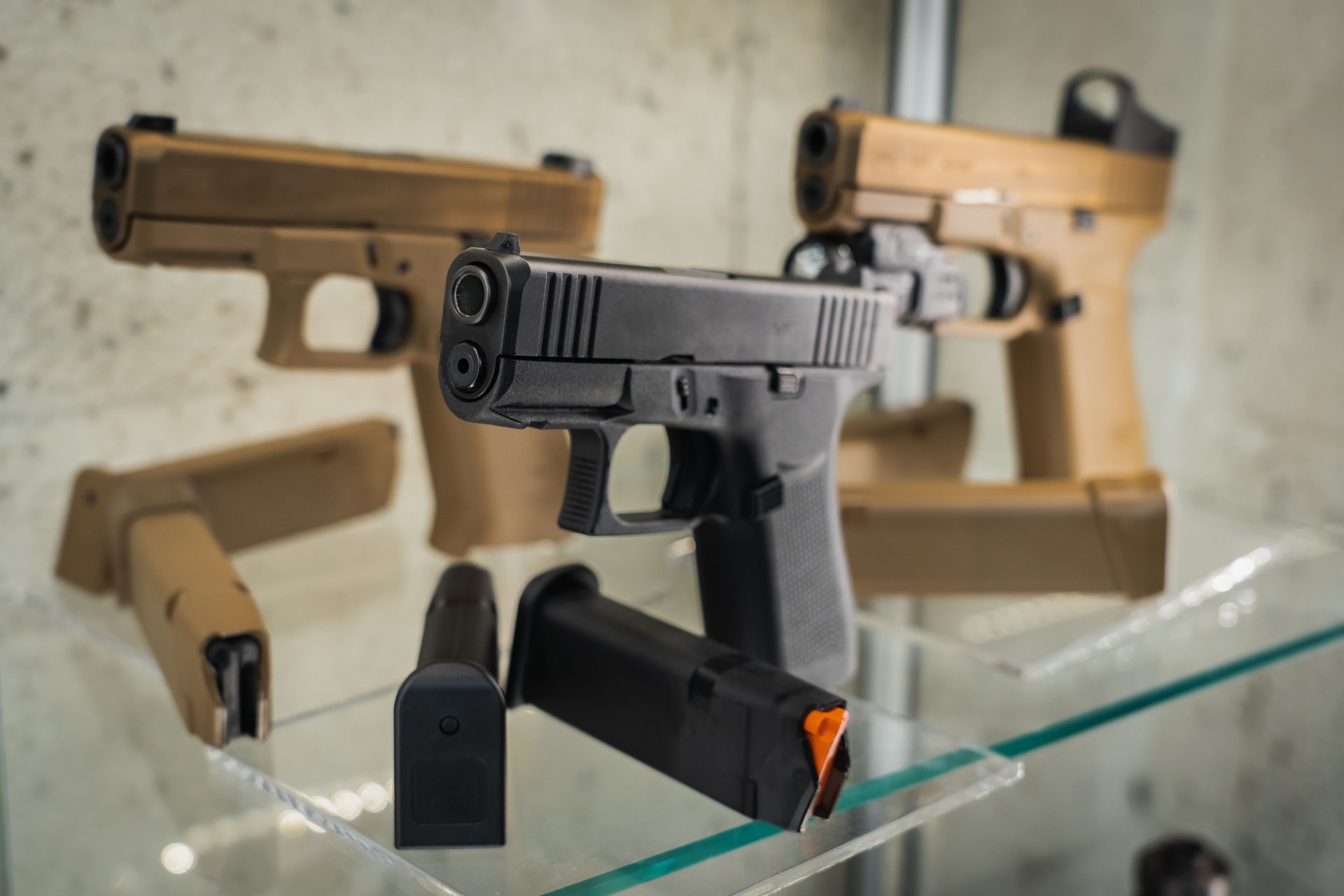 Firearms, pistols on display in a store, close-up photo.